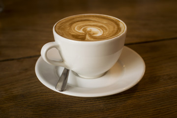 A cup of coffee over a table