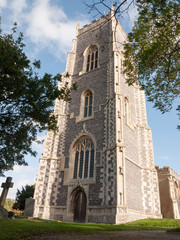 Fototapeta na wymiar large old stone english church Alresford high in the sky spire tower full view