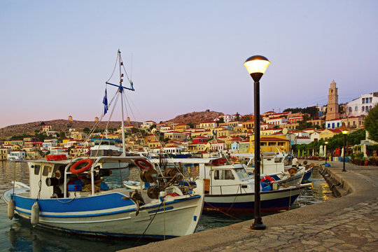 Early morning at the harbour of Greek island Chalki with fishing boats