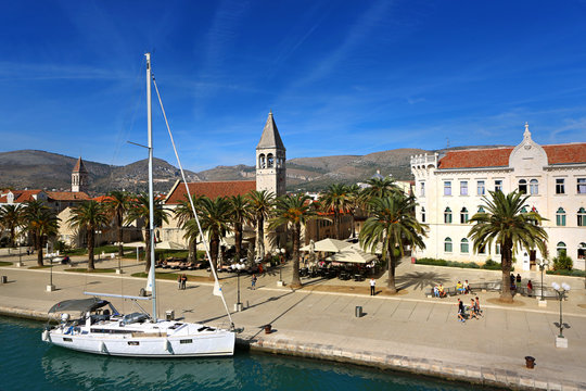 Trogir port with sail boat docked in front of St. Dominic church, Croatia