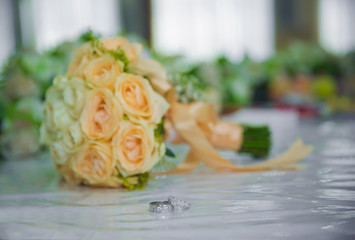 Yellow flower bouquet and rings for wedding.