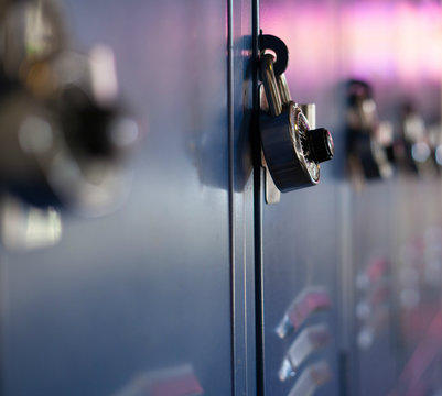 Rows of blue lockers at school - focus on the lock