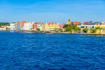 Fototapeta na wymiar Colorful Buildings in Willemstad downtown, Curacao, Netherlands Antilles, a small Caribbean island - travel destination for cruise ships or vacation
