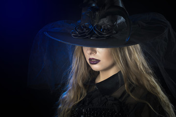 Beautiful woman in hat and leather gloves. Retro fashion model girl.black hat with large...
