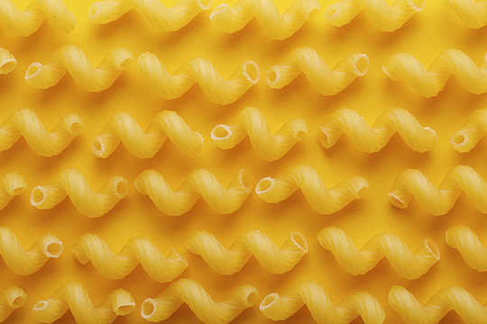 Raw cavatappi pasta texture