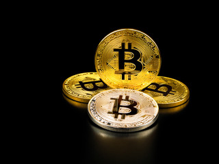 Golden and silver bitcoin on black background. Bitcoin cryptocurrency.