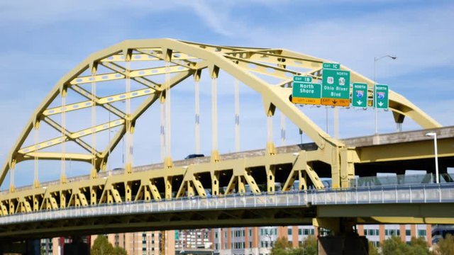 Traffic crossing the Roberto Clemente Bridge as seen from North Shore on bright day