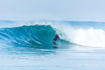 Bodyboarder surfing ocean wave