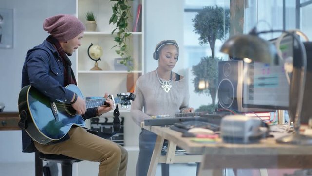  Young musicians recording a track in home studio