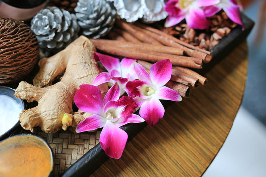 Thai style skin scrub and massage consisted of nature ingredient. Orchid flower on wooden tray, Health care and spa concept. Nature spa ingredient.
