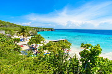Porto Marie beach - white sand Beach with blue sky and crystal clear blue water in Curacao,...