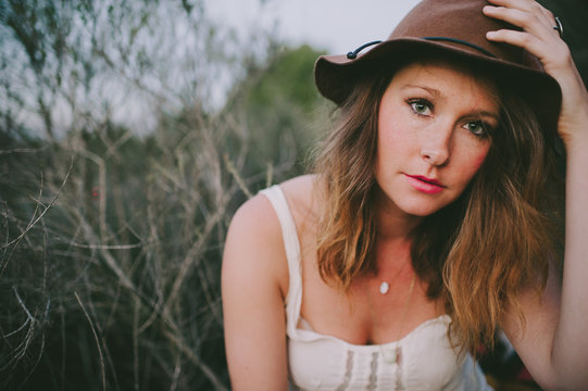 Portrait of pretty stylish woman wearing hat