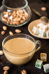 Coffee with milk, pistachios and turkish delight