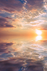Bright sunset and sun on the sea.