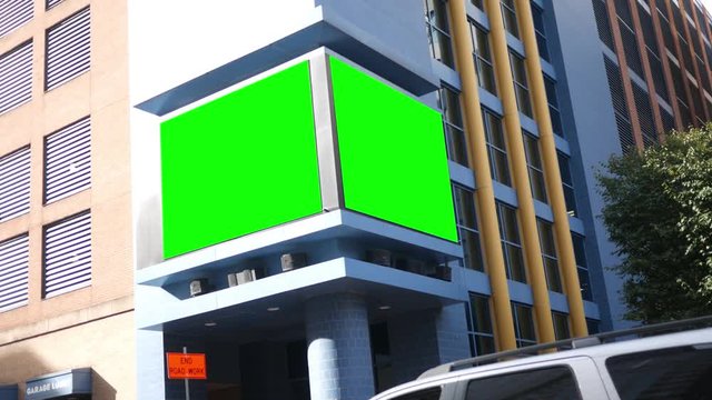 Green screen electronic billboard on city building for generic content