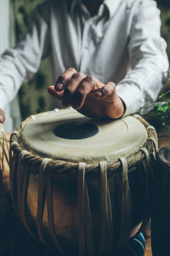 Indian man playing traditional indian drums