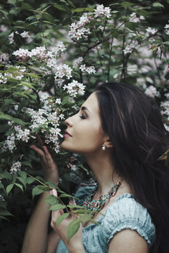 Woman smelling flowers