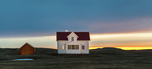 Norwegian beautiful house lit by the midnight sun