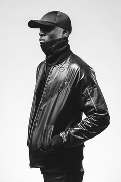 Black & white studio portraits of a fashionable young black man