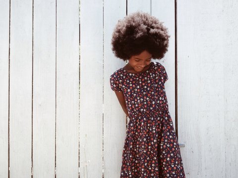 Little girl with big afro smiling