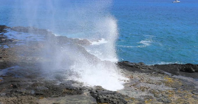Kauai Hawaii Ocean Park Spouting Horn blowhole close. Big Island, largest, most volcanic active location. Economy is tourism based. Water and tropical beach recreation and fun.