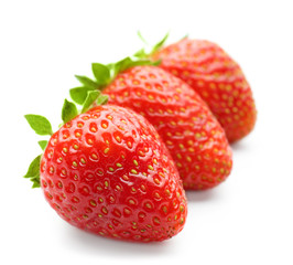 Ripe strawberries on white background