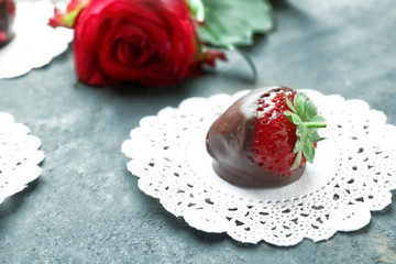 Tasty glazed strawberry on table