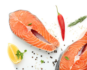 Fresh salmon steaks on white background