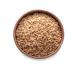 Plate with cooked buckwheat on white background