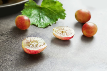 Fresh ripe grapes on table