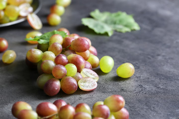 Fresh ripe grapes on table