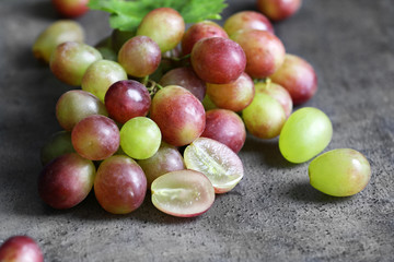 Fresh ripe grapes on table
