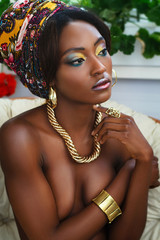Beautiful dark skin afro girl with professional make-up and gold jewelry - 178029068