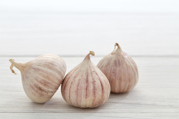 Fresh healthy garlic on white table