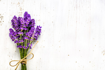 Summer flowers of lavender, bouquet on white wooden background, top view