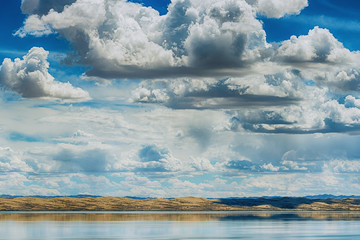 panoramic view of seascape with sandy hills at sunny day
