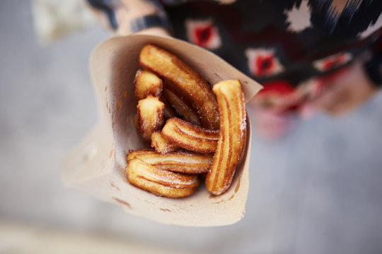 Woman holding churros