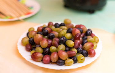ripe grapes on a plate