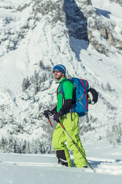 Portrait of a ski tourer in austian winter landscape