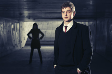 Fototapeta premium Young handsome businessman in underground tunnel