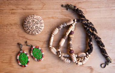 Top view of set of handmade jewelry in indian, bohemian style. Fashion background with necklace,...