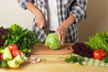 Woman cooks at the kitchen