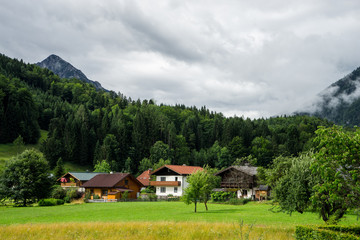 Fototapeta na wymiar village houses in a mountain Alps landscape