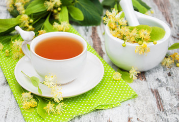 cup of herbal tea with linden flowers