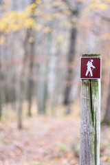 hiking trail sign on post