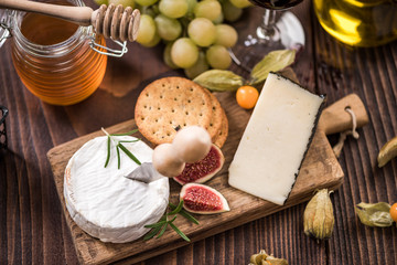 Cheese board with crackers,fig and grapes
