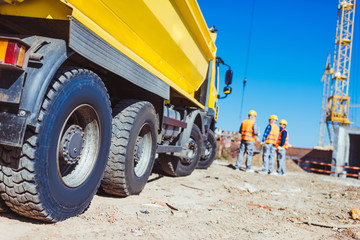 tip truck and construction workers