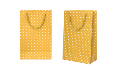 Yellow polka dot paper bag isolated on white background. Clipping Path. . © resul