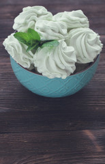 Mint Marshmallow or zephyr in the bowl with a leaf of mint