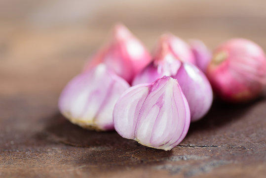 Slice shallots on wooden background for cooking,spice an herb,food ingredient